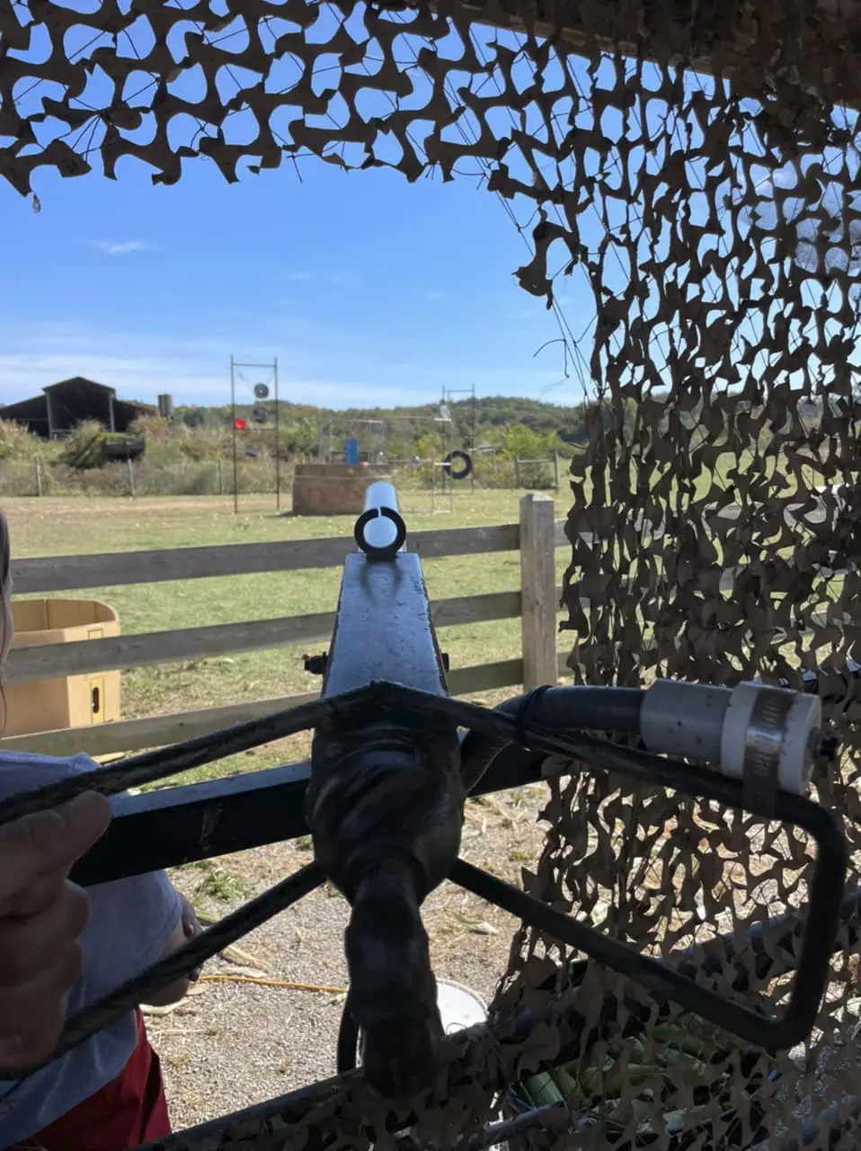 Teacher guiding a group of children through a reading activity using illustrated cards.